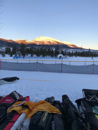 Ski bags, Race Course in front of a mountain in the sunrise.